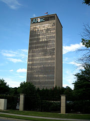A skyscraper with a large A F L A C sign on top