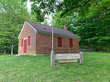 Street view of the Coventry Brick School House