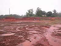 Red clay soil is common throughout the Southern United States, especially around the Piedmont. This photo was taken in North Carolina.