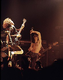 Bon Scott (centre), performing with AC/DC at the Ulster Hall in August 1979