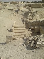 Archaeological site with stairs and remains of walls