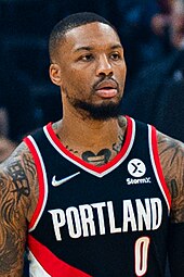 Damian Lillard in a black Portland jersey in a game for the Blazers in 2021