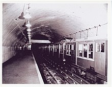 A rapid transit train in an arched underground station