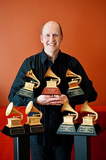 Brian Vibberts is surrounded by his 7 Grammy Awards in 2023