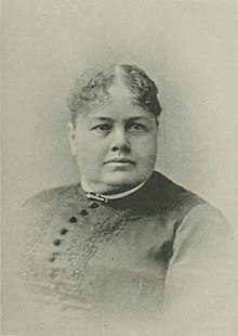 Sepia and white portrait photograph of a white, middle-aged woman