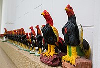Cock statuettes offered to Phan Thai Norasing