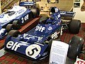 Jackie Stewart's final Grand Prix car, Tyrrell 006/2, resting on a carpet of Royal Stewart tartan in the Donington Grand Prix Collection.