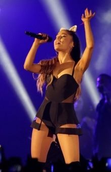 Ariana Grande performing on tour