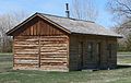 A reconstruction of the Fort Robinson adjutant office in Nebraska has corner post construction with log infill.