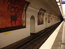 Curved station wall, with advertisements