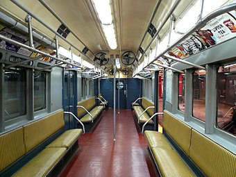 Interior of IRT R12 subway car with rattan seat cushions