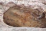 Rock paintings depicting people and animals