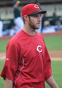 A man in a red baseball uniform and cap