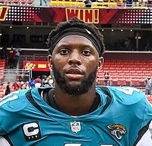 Josh Allen from the chest up in a Jacksonville Jaguars jersey and black head band.