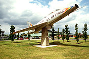 The F-100 is displayed on a permanent stand. It was the second aircraft to represent the Liberty Wing. It flew for the 48th Fighter Wing between 1956 and 1972 before it was replaced by the F-4 Phantom.