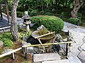 The suikinkutsu is a subtle garden instrument hidden beneath the gravel in some water basins.