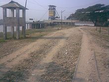 Image of two buildings and a road that are part of the Chhatak Cement Factory.
