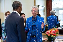 President Barack Obama greets Lesko, who is wearing one of his signature question-mark suits.