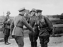 A photo of a German and a Soviet officer shaking hands at the end of the invasion of Poland.
