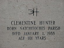 Inscription on gravestone reads. Distinctive signature, backwards C interlocking with H. Clementine Hunter, Born Natchitoches Parish, Died January 1, 1988, Age 101 Years.