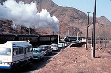 A steam locomotive and a diesel locomotive near Badaling in 1979