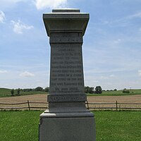Boggs monument. Inscription reads "Maj. John Boggs born near Wheeling, W. Va 1775 moved to Ohio with his father 1798. Married Sarah McMecher 1800 raised eight children all born in a cabin that stood on this spot. His wife Sarah died 1851. He died 1862."