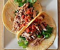 Tacos prepared with a carnitas filling