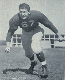 A black and white photo of Pregulman in his uniform on a field