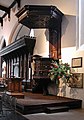 The Jacobean pulpit of St Helen's, Bishopsgate, which is now located perpendicular to the communion table