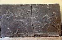 Assyrian chariot, charioteer, and a horse rider. Basalt wall reliefs from the palace of Tiglath-pileser III at Arslan Tash, Syria. 744-727 BCE. Ancient Orient Museum, Istanbul