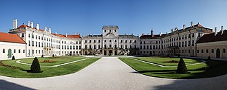 A large palace with a large garden