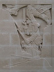 One of Charles Sergeant Jagger's reliefs on the Cambrai Memorial. A soldier uses a periscope in a trench.