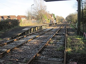 A short railway platform with two lines running past