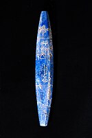 The lapis lazuli bead from Mari, National Museum of Damascus, Syria ("King of Ur", 𒈗𒋀𒀊𒆠 side).[16][17][18]