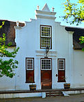 This imposing architectural complex consists of a Cape Dutch house which was erected in about 1815 and a double-storeyed annex which dates back to about 1960. The property is closely associated with two well-known Stellenbosch families, i.e. the Neethlings and Ackermanns.