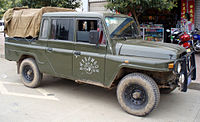 Liangshan Yi autonomous prefecture government Beijing BJ2032 SAQ pickup which combines the 1965 nose with the post-2000 doors.