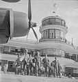 The first British prisoners of war to be evacuated from Singapore after liberation walk to their aircraft