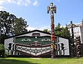 Assorted totem poles and Kwakwaka'wakw big house at Thunderbird Park