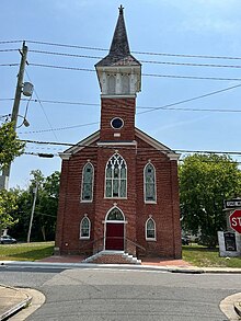 tall red brick church