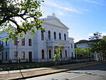 This building was erected between 1880 and 1886 to provide proper housing for the Stellenbosch College. This so-called Main Building is in the Neo-Classical style, Carl Hager being the architect, and played an important part in the history of the Victoria College and later the University of Stellenbosch.