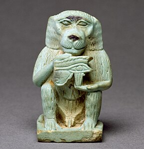 Ancient Egyptian amulet of Thoth as a baboon holding an eye of Horus, with a volute in the lower left part of the eye, 664-332 BC, Egyptian faience with light green glaze, Walters Art Museum, Baltimore, Maryland, US
