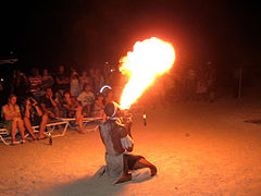 A fire breather performing for tourists in Antigua in the Caribbean.