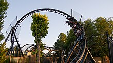 Photo of Batman Gotham City Escape, showing its first inversion, a counter-clockwise corkscrew leading into the roller coaster's second LSM launch.