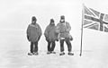 Ernest Shackleton and team planting the flag