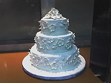 multi-tiered cake decorated in white icing