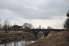 Bank Bridge, the warehouse, which carries the A59 road over the River Douglas