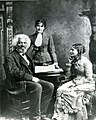 Frederick Douglass with his second wife Helen Pitts Douglass and her sister (standing), c. 1884