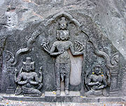 Sadasiva standing midst Brahma and Vishnu. 10th c. CE sculpture at Vat Phou, Laos
