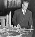Image 22Robert Moses with a model of his proposed Battery Bridge, never built (from History of New York City (1898–1945))