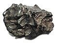 A 1.7-kilogram (3.7 lb) individual meteorite from the 1947 Sikhote-Alin meteorite shower (coarsest octahedrite, class IIAB). This specimen is about 12 centimetres (4.7 in) wide.